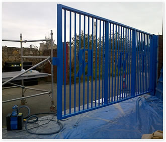 On-site spray painting a gate